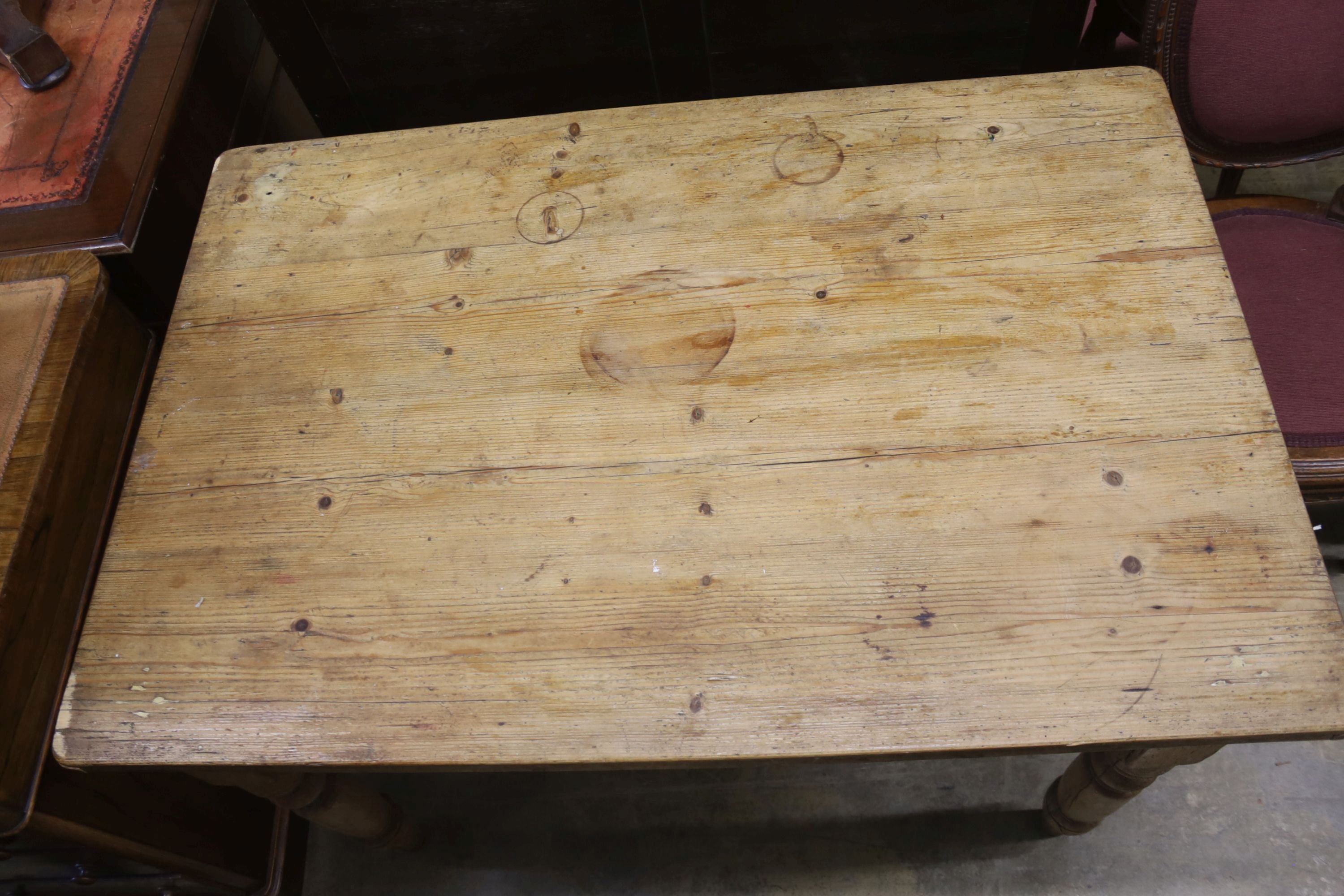 A rectangular pine kitchen table, length 112cm, depth 75cm, height 72cm